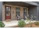 Charming front porch with rocking chairs, offering a welcoming entrance to the home at 6785 Pippin Walk, Alpharetta, GA 30005