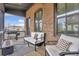 Relaxing outdoor porch with comfortable seating and a stylish rug for added comfort at 6785 Pippin Walk, Alpharetta, GA 30005
