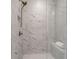 A shower featuring a rainfall shower head, stone and glass enclosure, and a built in seat at 6785 Pippin Walk, Alpharetta, GA 30005