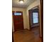 Inviting entryway featuring wood floors and a wooden front door at 1902 Godby Rd, Atlanta, GA 30349