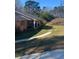 Charming brick home with a front porch and a well-maintained lawn at 1902 Godby Rd, Atlanta, GA 30349