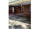 Spacious garage featuring a ceiling fan, ample lighting and a sturdy brick foundation at 1902 Godby Rd, Atlanta, GA 30349