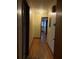 Hallway with wood floors, doors, and neutral wall colors at 1902 Godby Rd, Atlanta, GA 30349