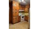 Traditional kitchen featuring wood cabinets and a white range at 1902 Godby Rd, Atlanta, GA 30349