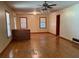 Spacious living room with wood floors, lots of windows, and a unique brick feature at 1902 Godby Rd, Atlanta, GA 30349