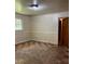 Spacious room with checkerboard flooring and a large window at 1902 Godby Rd, Atlanta, GA 30349