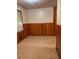 Cozy room featuring wood paneling and a bright window at 1902 Godby Rd, Atlanta, GA 30349