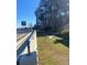Roadside view with a guardrail and green space at 1902 Godby Rd, Atlanta, GA 30349