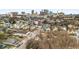 Aerial view of a residential neighborhood with colorful houses, mature trees, and the city skyline in the distance at 572 Martin Se St, Atlanta, GA 30312