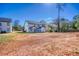 Backyard view of the home and large grassy lawn at 1064 Eastview Ne Rd, Conyers, GA 30012