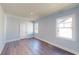 Bedroom features hardwood floors, white trim and two windows at 1064 Eastview Ne Rd, Conyers, GA 30012