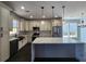 Modern kitchen featuring an island, stainless steel appliances, and attractive pendant lighting at 1064 Eastview Ne Rd, Conyers, GA 30012