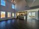 Open living space showcases high ceilings, large windows, and a modern kitchen at 1064 Eastview Ne Rd, Conyers, GA 30012