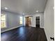 The main bedroom features a barn door to the bathroom, large windows, and wood-look flooring at 1064 Eastview Ne Rd, Conyers, GA 30012