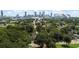 Panoramic aerial view of the city skyline with lush green trees at 203 Sunset Nw Ave, Atlanta, GA 30314