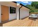 Back deck featuring a bench, small table, and access to the home at 203 Sunset Nw Ave, Atlanta, GA 30314