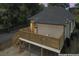 Back exterior features a new wooden deck with stairs and fenced yard at 203 Sunset Nw Ave, Atlanta, GA 30314