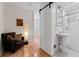 Bathroom featuring a glass-enclosed shower, pedestal sink, and modern fixtures at 203 Sunset Nw Ave, Atlanta, GA 30314