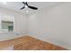 Bright bedroom featuring hardwood floors, a ceiling fan and a window at 203 Sunset Nw Ave, Atlanta, GA 30314