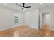 Bedroom with hardwood floors, a ceiling fan, closet and a window that lets in natural light at 203 Sunset Nw Ave, Atlanta, GA 30314