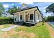 Beautiful home exterior with a covered porch and well-manicured lawn at 203 Sunset Nw Ave, Atlanta, GA 30314