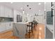 Beautiful kitchen featuring white cabinets, stainless steel appliances and a marble countertop island at 203 Sunset Nw Ave, Atlanta, GA 30314