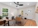 Cozy living room with hardwood floors, stylish rug, and modern ceiling fan at 203 Sunset Nw Ave, Atlanta, GA 30314