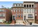 Charming brick townhome with attached garage and inviting front entrance with beautiful architectural detail at 3641 Broughton Se Cir, Atlanta, GA 30339