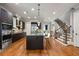 Open concept kitchen with an island, stainless steel appliances, and hardwood floors at 3641 Broughton Se Cir, Atlanta, GA 30339