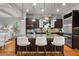 Modern kitchen with stainless steel appliances, granite countertops, and stylish pendant lighting at 3641 Broughton Se Cir, Atlanta, GA 30339