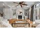 Bright living room with fireplace, built-in shelves, coffered ceilings, and ample natural light at 3641 Broughton Se Cir, Atlanta, GA 30339