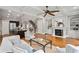 Open-concept living room showcasing the kitchen, fireplace, and hardwood floors at 3641 Broughton Se Cir, Atlanta, GA 30339