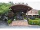 Charming entrance to Canoe restaurant, featuring a brick facade, arched canopy and lush greenery at 3641 Broughton Se Cir, Atlanta, GA 30339