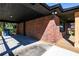 A view of the spacious back porch with its brick wall and black accents at 228 W Simon Nw Ter, Atlanta, GA 30318