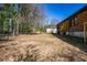 A view of the backyard with a brick house and a chain link fence at 228 W Simon Nw Ter, Atlanta, GA 30318