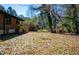 Vast backyard, with trees on the edge of the property, showing the large outdoor area at 228 W Simon Nw Ter, Atlanta, GA 30318