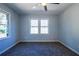 Well-lit bedroom featuring neutral carpeting, and natural light from double windows at 228 W Simon Nw Ter, Atlanta, GA 30318