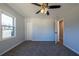 Cozy bedroom with neutral carpeting, closet, natural light and ceiling fan with light at 228 W Simon Nw Ter, Atlanta, GA 30318