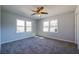 Sunlit bedroom with soft gray walls, neutral carpeting, and natural light from large windows at 228 W Simon Nw Ter, Atlanta, GA 30318