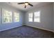 Bright bedroom featuring neutral carpeting, large windows, and ample natural light at 228 W Simon Nw Ter, Atlanta, GA 30318