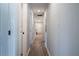 Bright hallway with updated lighting and fresh paint leading to kitchen at 228 W Simon Nw Ter, Atlanta, GA 30318