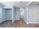 Hallway to laundry room with wood-look floors and neutral paint at 228 W Simon Nw Ter, Atlanta, GA 30318