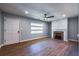 Bright living room with a decorative fireplace, and hardwood floors providing a cozy atmosphere at 228 W Simon Nw Ter, Atlanta, GA 30318