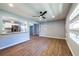 Open-concept living room featuring wood-look floors, and breakfast bar through to the kitchen at 228 W Simon Nw Ter, Atlanta, GA 30318