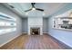 Inviting living room with fireplace, stylish flooring, open layout, and ample natural light at 228 W Simon Nw Ter, Atlanta, GA 30318