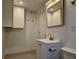 Bathroom featuring white vanity, updated mirror and fixtures, and tiled floor at , Decatur, GA 30032