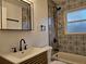 This bathroom features modern fixtures, patterned tile walls, and a sleek sink vanity at , Decatur, GA 30032