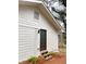 Back entrance to home featuring stairs to door with painted siding and landscaping at , Decatur, GA 30032