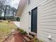 Exterior showcasing siding, a dark front door, stairs, and well-maintained landscaping at , Decatur, GA 30032