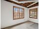 Unfinished basement space features two windows bringing in natural light and exposed ceiling at 1585 Lazy River Ln, Sandy Springs, GA 30350